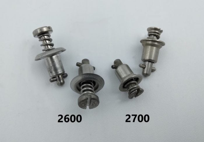 Stainless steel 2600 and 2700 Airloc fasteners are shown. The 2600 fasteners are on the left, and the 2700 fasteners are on the right, each with a spring mechanism and labeled accordingly.